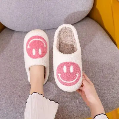 Melody Smiley Face Slippers Introducing the adorable Smiley Face Cozy Slippers! These cozy and plush slippers are designed to bring a smile to your face every time you put them on. With their soft and warm material, you'll feel like you're walking on clou