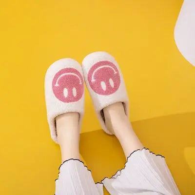 Melody Smiley Face Slippers Introducing the adorable Smiley Face Cozy Slippers! These cozy and plush slippers are designed to bring a smile to your face every time you put them on. With their soft and warm material, you'll feel like you're walking on clou